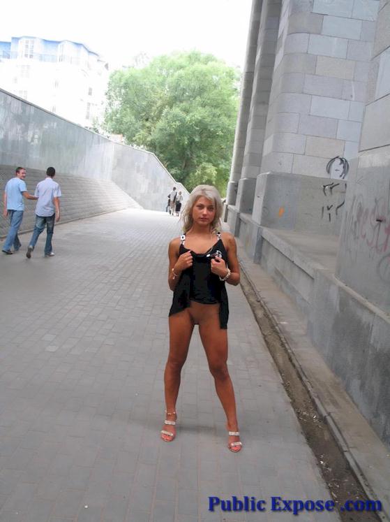 Blonde get naked in a street