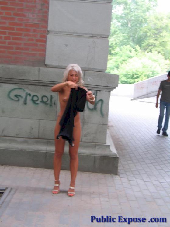 Blonde get naked in a street