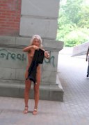 Blonde drops her clothes in the street