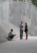 Blonde drops her clothes in the street
